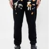 Roku Studio (black/orange” Tear Dripping Jogger)