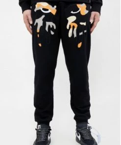 Roku Studio (black/orange” Tear Dripping Jogger)